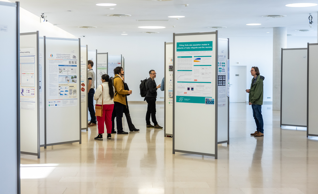 People looking at a scientific poster exhibition