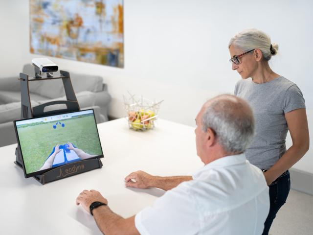 Photo of a man using AI-based rehabilitation