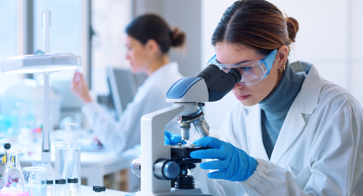 Image of a scientist using a microscope