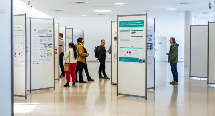 People looking at a scientific poster exhibition
