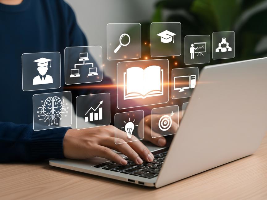 Person working on laptops with icons in the forefront symbolizing education